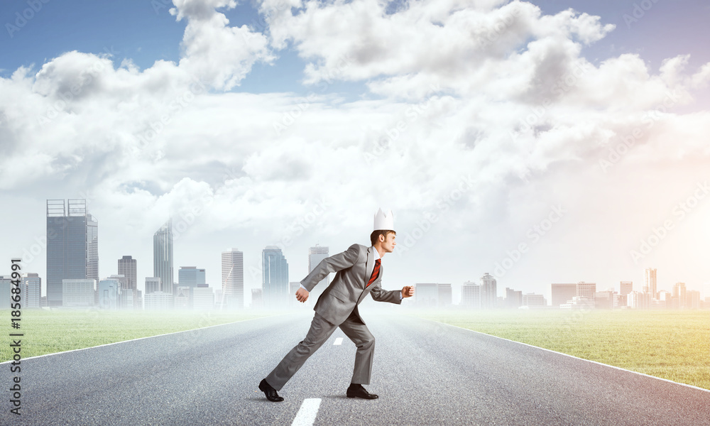 King businessman in elegant suit running and business center at background King businessman in elegant suit running and business center at background