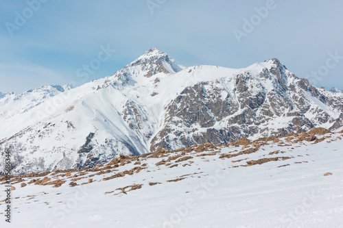 Mountain winter landscape with white peaks.