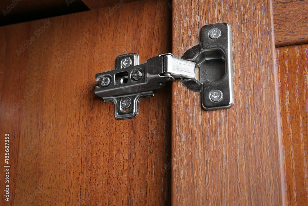 Fototapeta premium Metal hinges of wardrobe, closeup