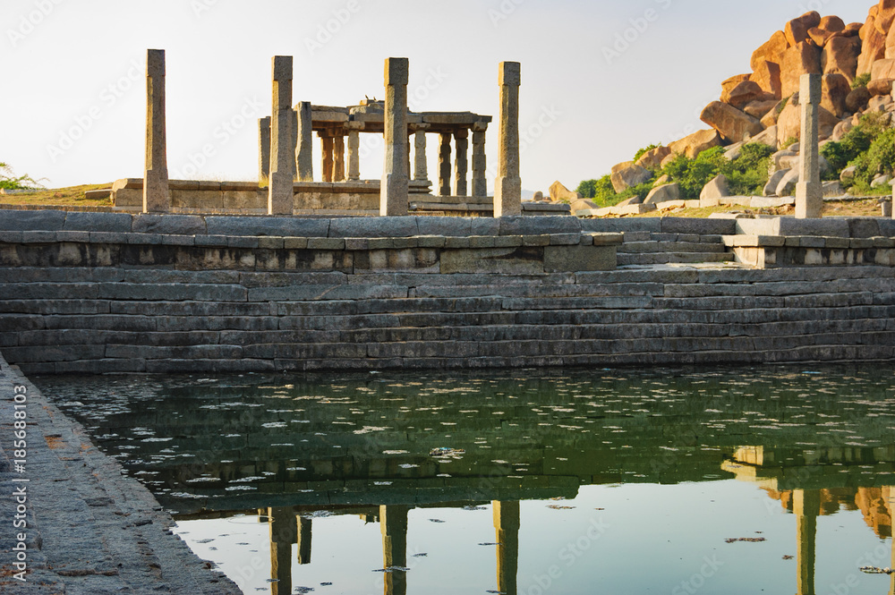 Pushkarani is a sacred lake on the way to the Vitthala temple in Hampi, Karnataka, India. The pond served to the ritual and functional aspects of the temple and life surrounding it.