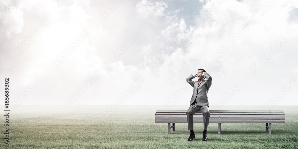 Young man in suit in park dont want to hear anything Young man in suit in park dont want to hear anything