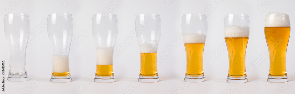 Lager beer in glass. Steps of filling glass of beer. Lager beer in glass. Steps of filling glass of beer.