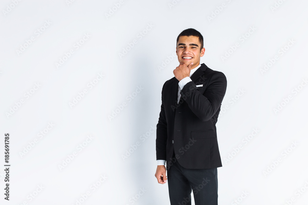 handsome young man in a stylish suit, posing on a white background isolated handsome young man in a stylish suit, posing on a white background isolated