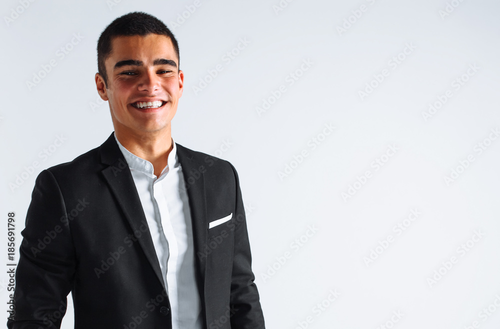 handsome young man in a stylish suit, posing on a white background isolated handsome young man in a stylish suit, posing on a white background isolated