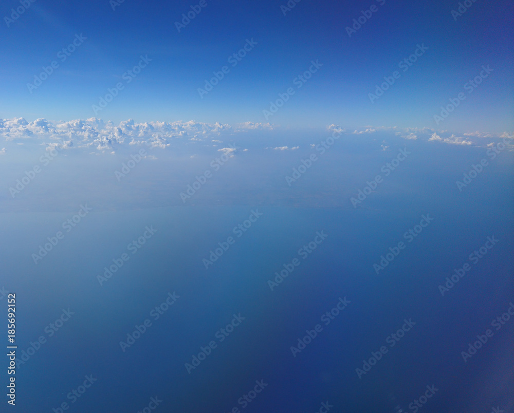 Fototapeta premium Clouds on the sky in the aircraft illuminator