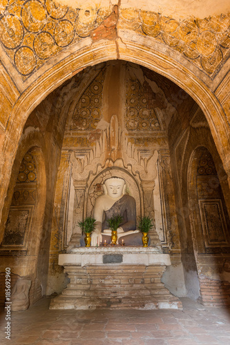 Front view of a statue of sitting Buddha at the Khaymingha Temple complex in Bagan  Myanmar  Burma .