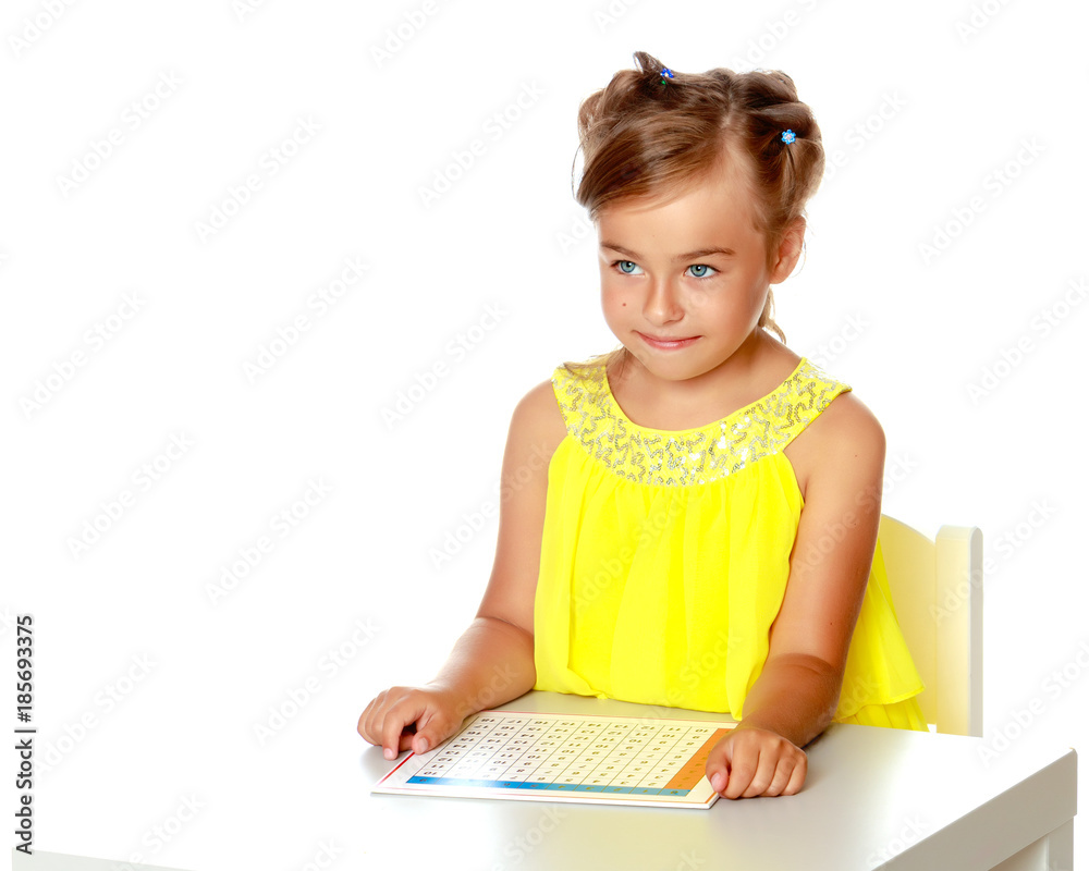 A little girl is studying Montessori stuff. A little girl is studying Montessori stuff.