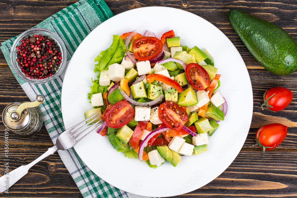 Dietary salad of fresh vegetables with avocado and goat cheese Dietary salad of fresh vegetables with avocado and goat cheese
