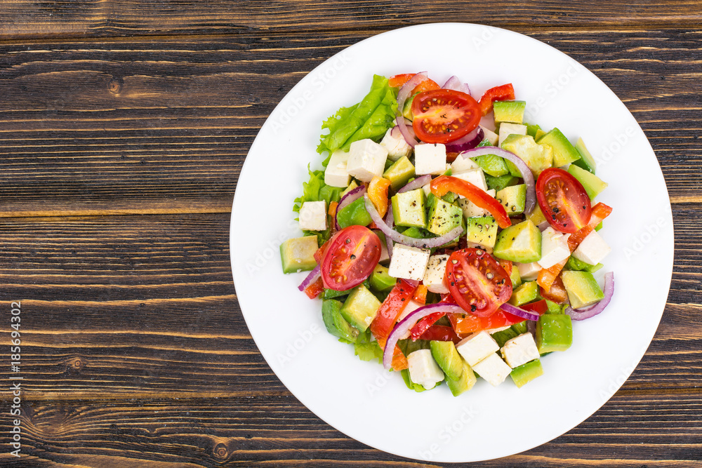 Dietary salad of fresh vegetables with avocado and goat cheese Dietary salad of fresh vegetables with avocado and goat cheese