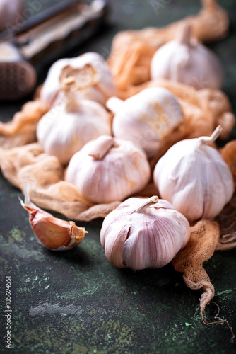 Fresh garlic on green background