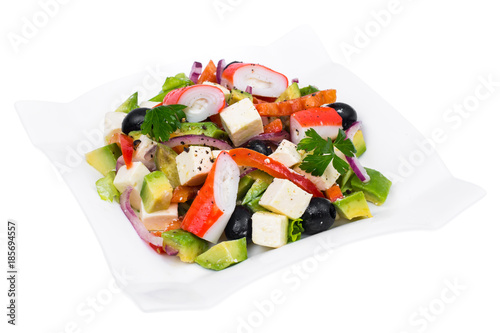 Vegetable salad with avocado, surimi and fetus