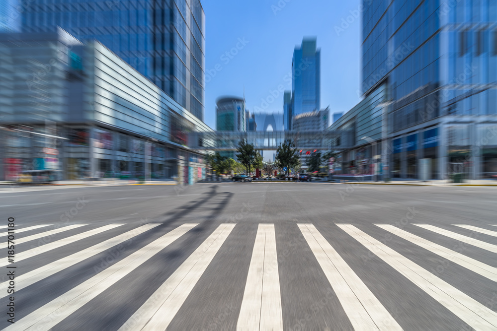 empty road with zebra crossing and skyscrapers in modern city. empty road with zebra crossing and skyscrapers in modern city.