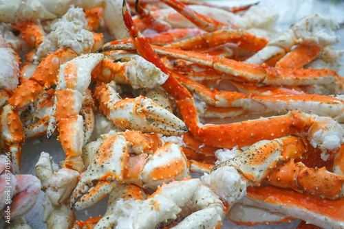 Close up on frozen crab legs on the ice