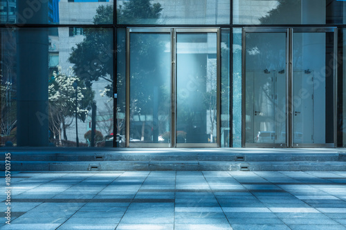 Photography empty pavement front of the modern office entrance.