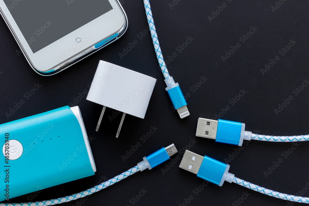 USB charging cables for smartphone and tablet in top view USB charging cables for smartphone and tablet in top view