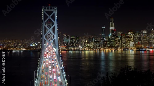 San Francisco Oakland Bay Bridge and Downtown at Night Panning Timelapse