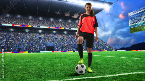 female football player in red uniform on soccer field