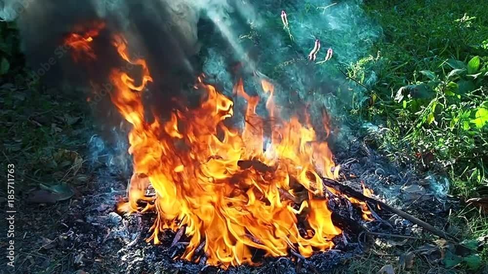 The red flames have a black smoke slowly. The red flames have a black smoke slowly.