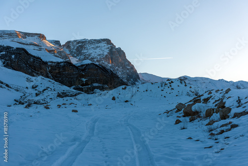 Snow covered mountains peaks, winter mountains photo