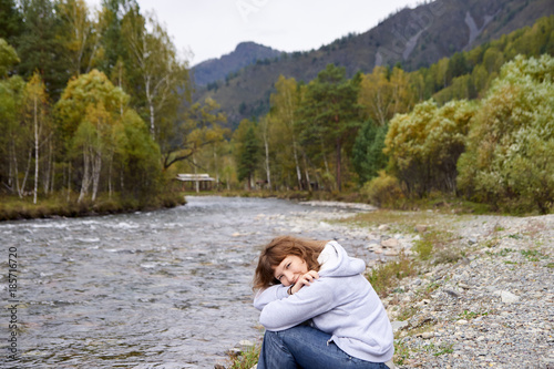Mountain river. Portrait girl. Altai. Autumn landscape