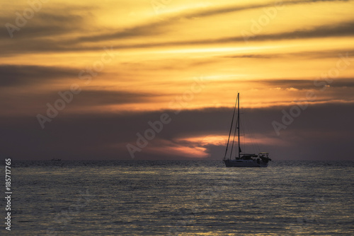 sunset on the beach at layan beach Phuket Thailand