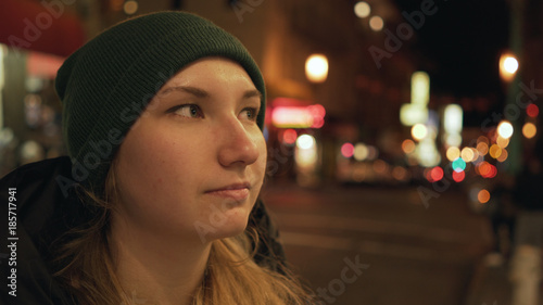 teen girl on street of Chinatown in San Francisco at night