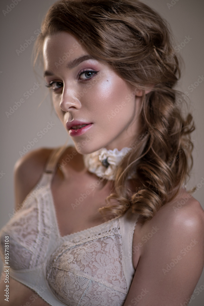 Beautiful woman in vintage white lingerie