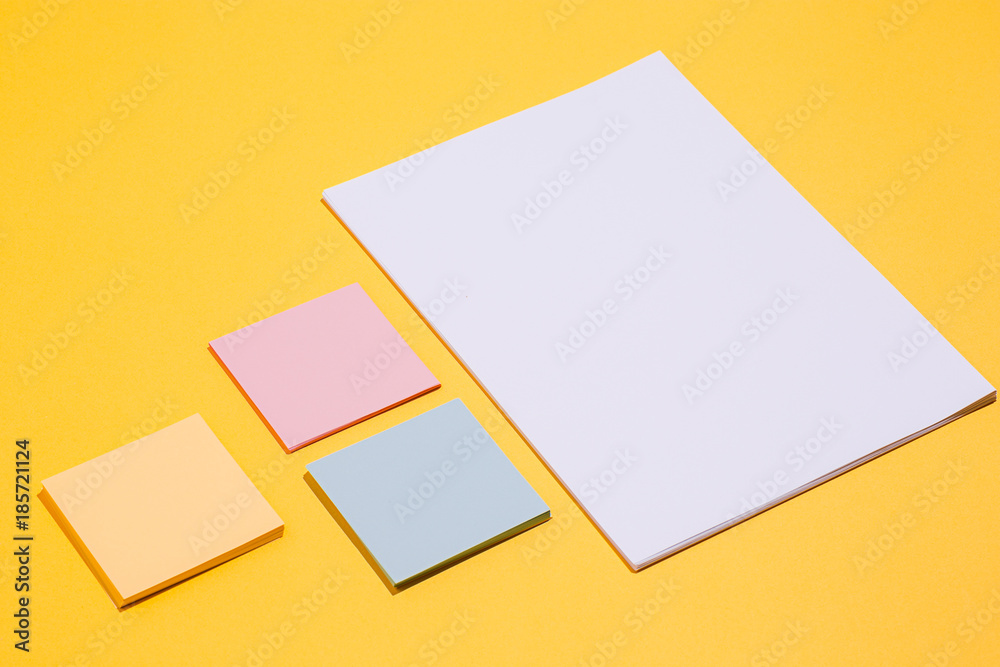 The many empty paper clips, yellow background The many empty paper clips, yellow background