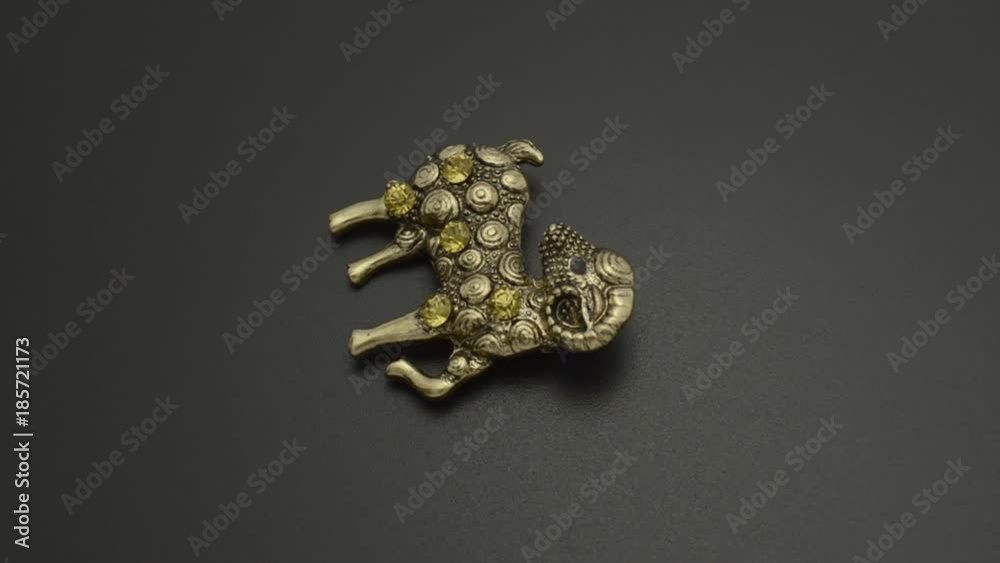 Copper brooch with diamonds aries isolated on black Copper brooch with diamonds aries isolated on black