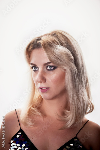 Beautiful young blonde woman with professional makeup Smokey eyes