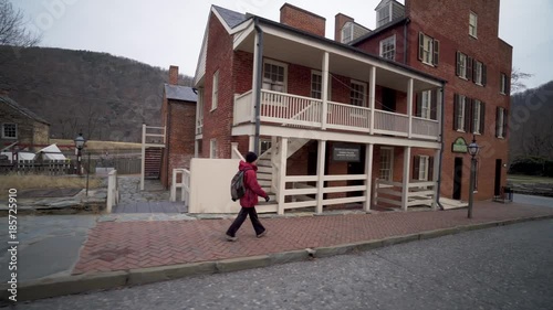 Wallpaper Mural Teenage boy vlogger and mature woman walks down a sidewalk in Harpers Ferry National Park in the historical section of Harpers Ferry, West Virginia Torontodigital.ca