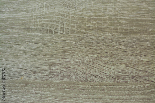 Light grey wooden pattern background.