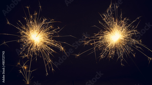 Christmas sparklers on a dark background. Copy of space.