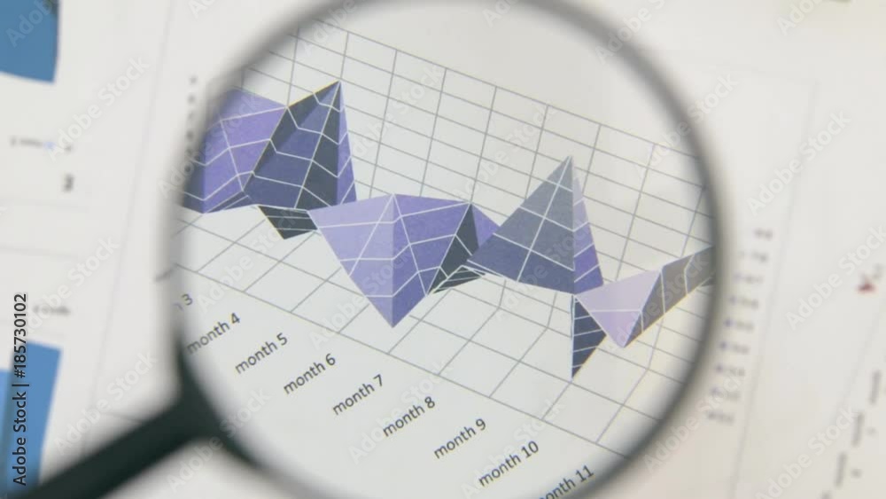 Close-up of the rotation of a magnifying glass and a lilac diagram. Optical distortion. Close-up of the rotation of a magnifying glass and a lilac diagram. Optical distortion.