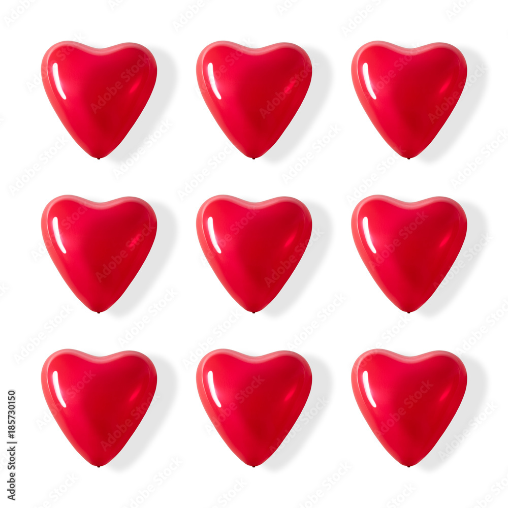Red heart shaped balloons on a white background.