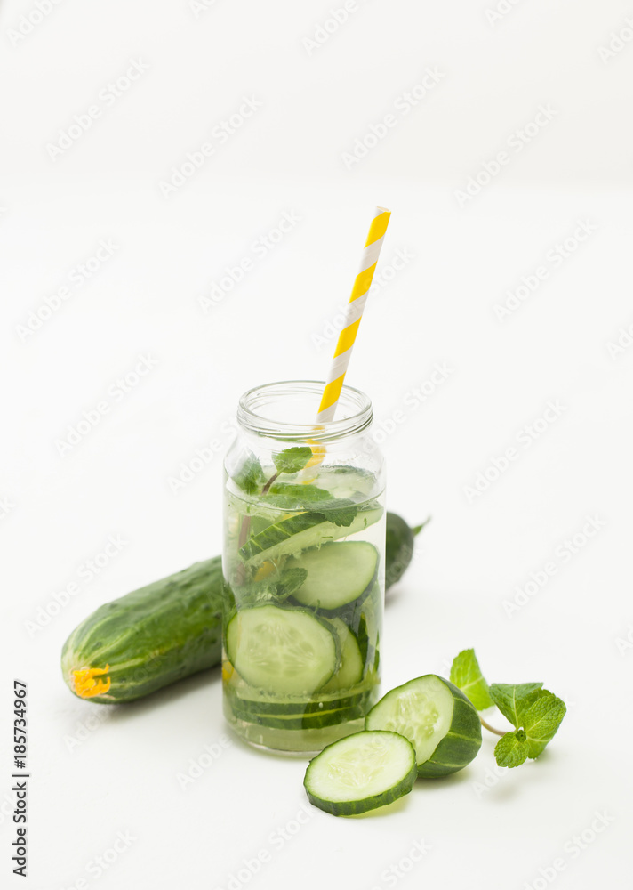 Fototapeta premium Drink of chopped cucumber and mint on white background