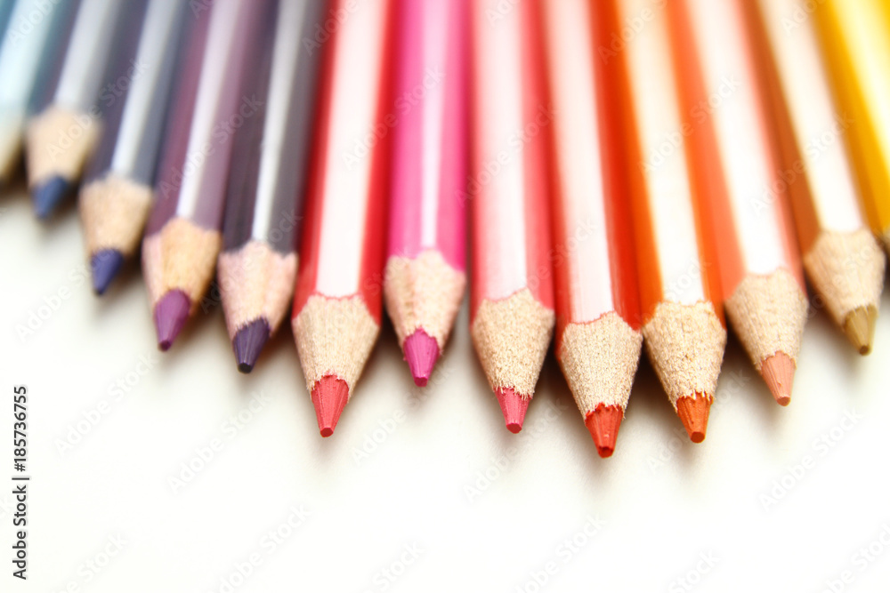 Colored Pencils as background / is an art medium constructed of a narrow, pigmented core encased in a wooden cylindrical case Colored Pencils as background / is an art medium constructed of a narrow, pigmented core encased in a wooden cylindrical case