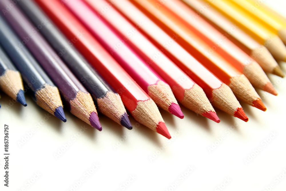 Colored Pencils as background / is an art medium constructed of a narrow, pigmented core encased in a wooden cylindrical case Colored Pencils as background / is an art medium constructed of a narrow, pigmented core encased in a wooden cylindrical case