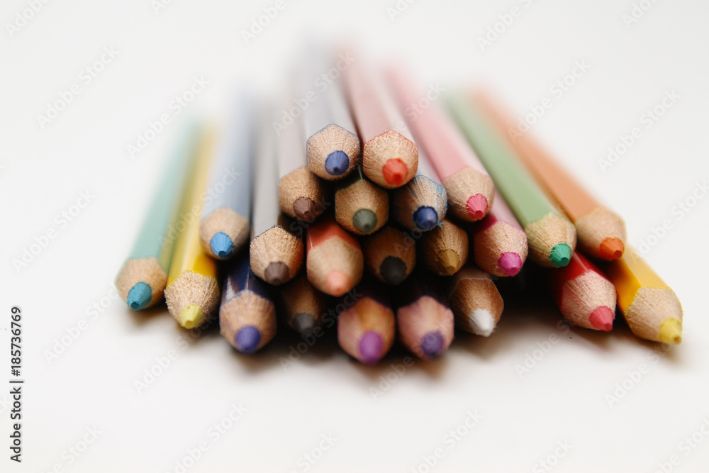 Colored Pencils as background / is an art medium constructed of a narrow, pigmented core encased in a wooden cylindrical case Colored Pencils as background / is an art medium constructed of a narrow, pigmented core encased in a wooden cylindrical case