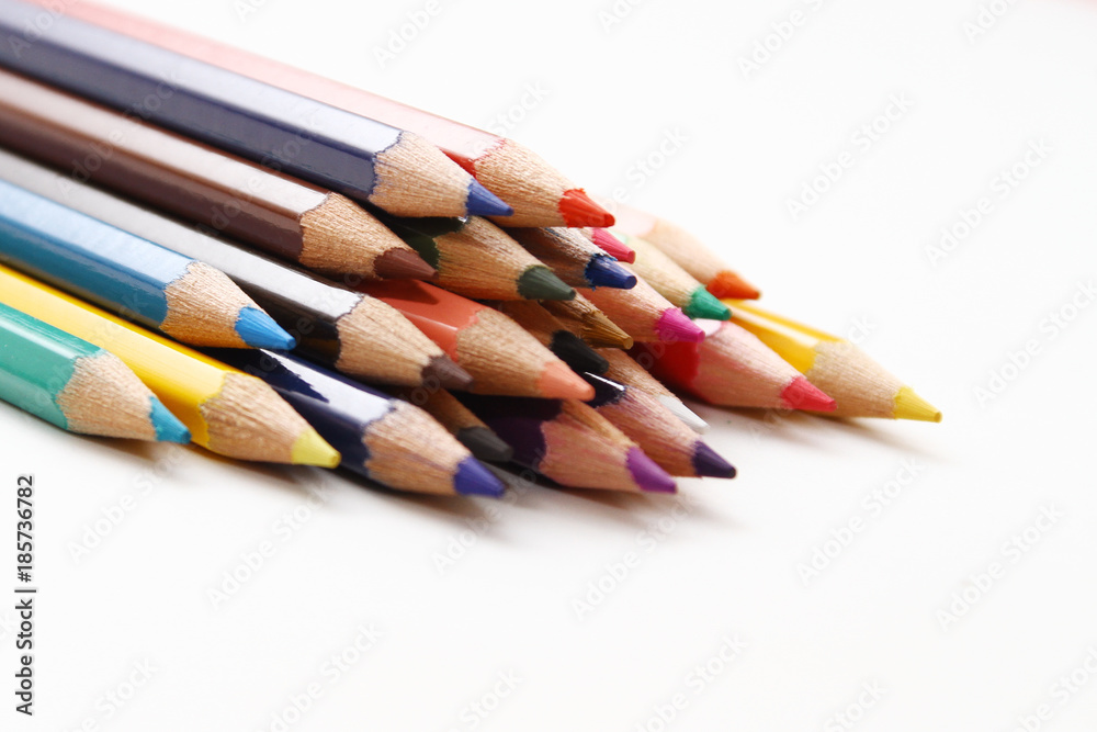 Colored Pencils as background / is an art medium constructed of a narrow, pigmented core encased in a wooden cylindrical case Colored Pencils as background / is an art medium constructed of a narrow, pigmented core encased in a wooden cylindrical case