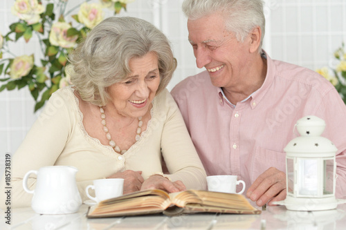 Senior couple drinking tea and reading magazine