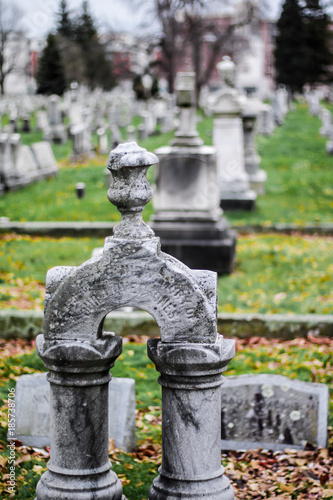 Daytime shallow depth of field picture of grave marker headstone in Mt. Hope cemetery in Rochester, New York