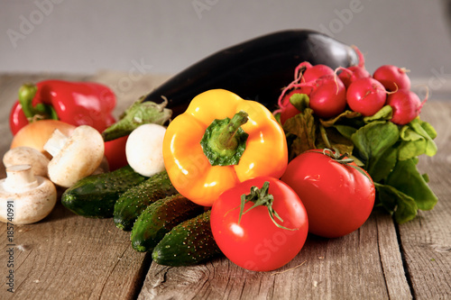 salad from fresh vegetables in a plate on a table, selective focus