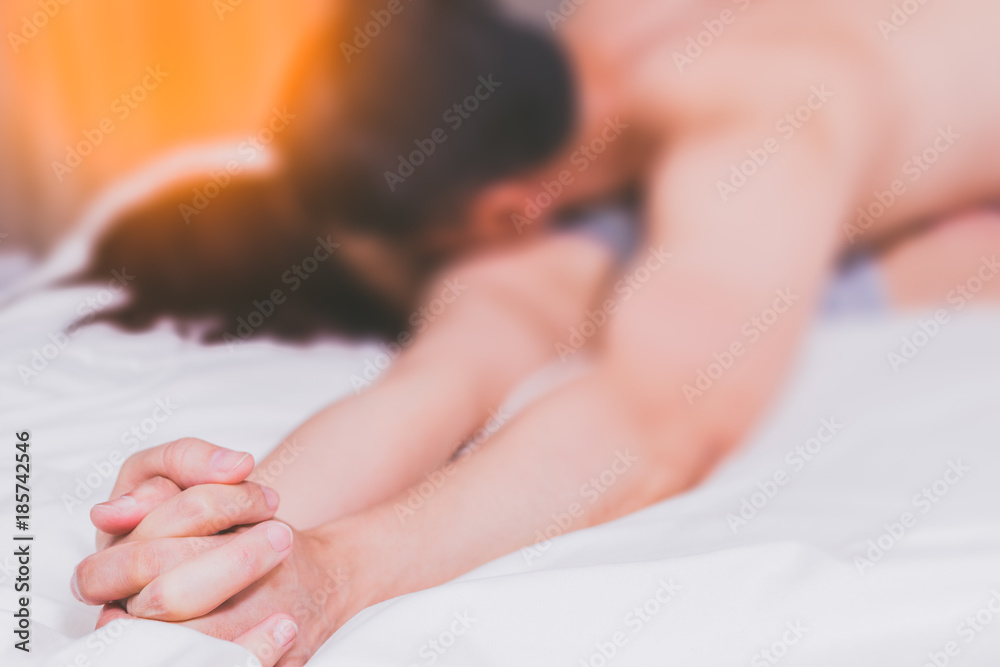 Intimate lovers making love in bed. Romantic and passionate young asian  couple on bed having sex Stock Photo | Adobe Stock