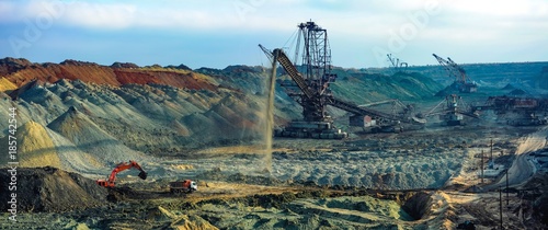 Production of manganese ore in the largest field in Europe. Open development. Huge machines of manganese ore mined in open pits. Metallurgical industry in Ukraine, Nikopol district.