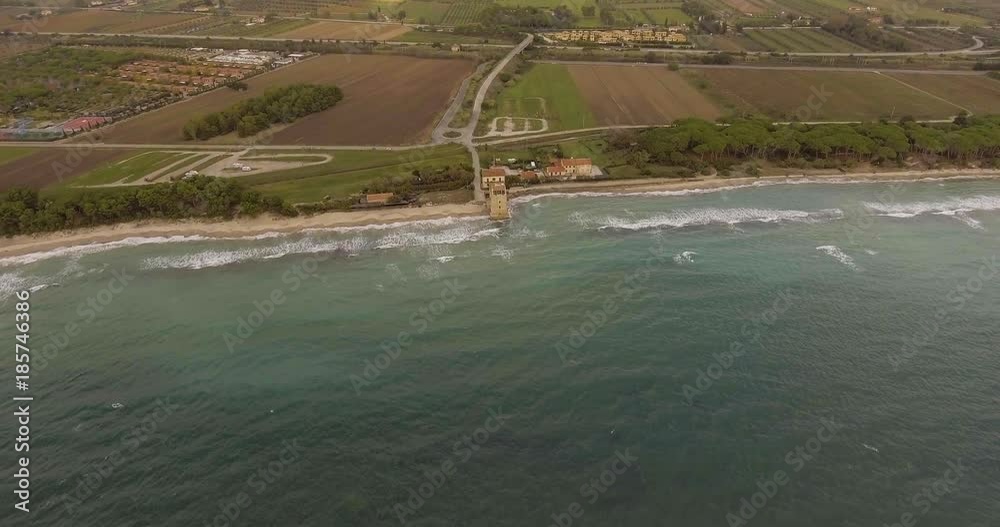 Aerial, a tower of a coastal fortification on the empty beach Aerial, a tower of a coastal fortification on the empty beach
