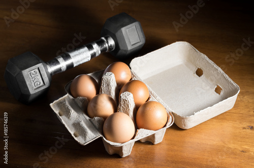 Eggs box with iron  dumbbell.