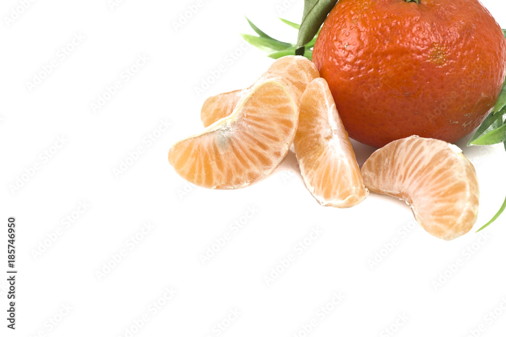 Mandarin or Tangerine fruit with leaves on a white background Mandarin or Tangerine fruit with leaves on a white background