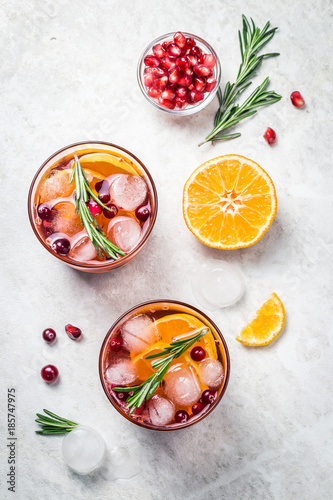 Winter holiday cranberry citrus pomegranate sangria. Top view, space for text.
