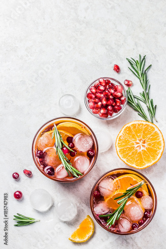 Winter  cranberry citrus pomegranate rosemary drink. Top view, space for text.